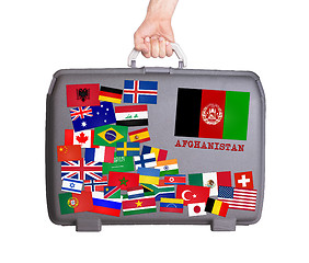 Image showing Used plastic suitcase with stickers