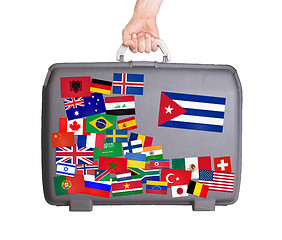 Image showing Used plastic suitcase with stickers