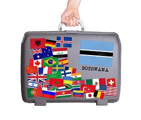 Image showing Used plastic suitcase with stickers