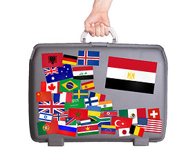 Image showing Used plastic suitcase with stickers