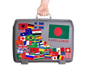 Image showing Used plastic suitcase with stickers