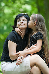 Image showing Daughter kissing her mom