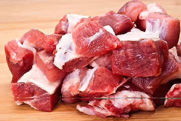 Image showing Raw beef on wooden board