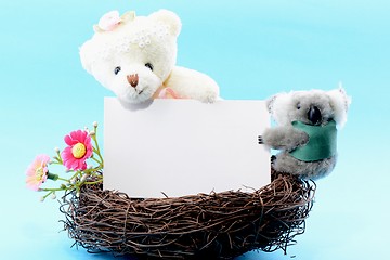 Image showing Nest with a blank card and teddy bear and koala