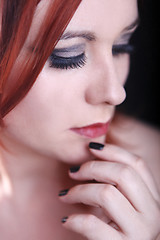 Image showing Red head woman with black nails