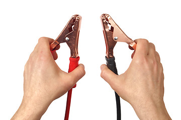 Image showing Hands with jumper cables on white