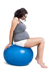 Image showing Pregnant woman doing pilates exercises