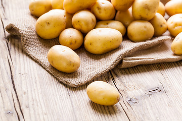 Image showing Farm fresh  potatoes on a hessian sack