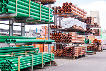 Image showing Plastic pipes in a factory or warehouse yard