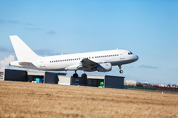 Image showing Passenger airliner taking off at an airport