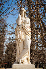 Image showing Bird perched on an ancient stone statue