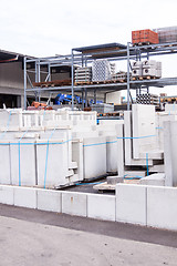 Image showing Cement building blocks stacked on pallets