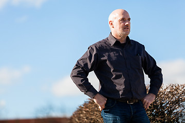 Image showing Thoughtful man sitting on a flight of steps