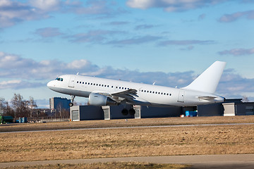 Image showing Passenger airliner taking off at an airport