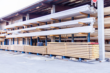 Image showing Wooden panels stored inside a warehouse