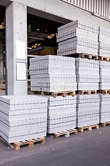 Image showing Cement building blocks stacked on pallets