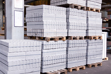 Image showing Cement building blocks stacked on pallets