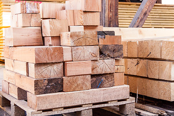 Image showing Wooden panels stored inside a warehouse