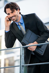 Image showing Businessman listening to a call on his mobile