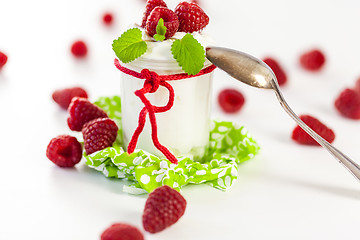 Image showing Raspberries and yoghurt or clotted cream