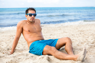 Image showing Handsome man relaxing on the beach