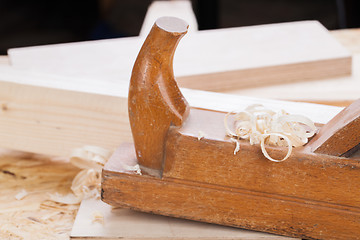 Image showing Handheld wood plane with wood shavings