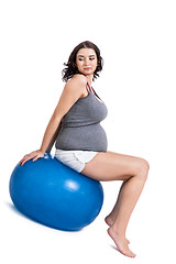 Image showing Pregnant woman doing pilates exercises