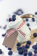 Image showing Jar of clotted cream or yogurt with blueberries