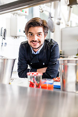 Image showing Chef cooking a vegetables stir fry over a hob