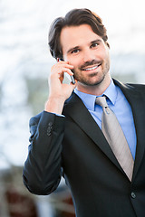 Image showing Businessman listening to a call on his mobile