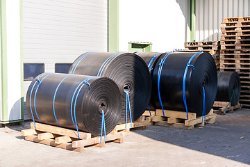 Image showing Rolls of black industrial plastic