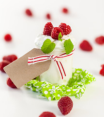 Image showing Raspberries and yoghurt or clotted cream