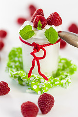 Image showing Raspberries and yoghurt or clotted cream