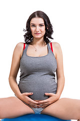 Image showing Pregnant woman doing pilates exercises