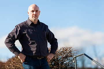 Image showing Thoughtful man sitting on a flight of steps