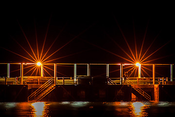 Image showing Night scene of a dock or pier with steps