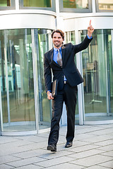 Image showing Motivated businessman punching the air