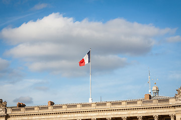 Image showing Flag of France fluttering under a serene blue sky