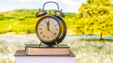 Image showing Clock and Bible