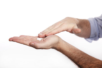 Image showing Man uses hand cream