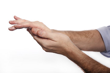 Image showing Man uses hand cream