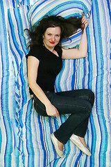 Image showing Woman lying on bed