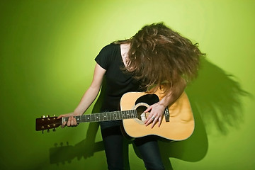 Image showing Woman posing with guitar