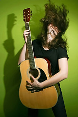 Image showing Woman holding guitar