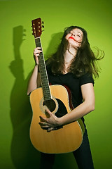 Image showing Rock woman playing guitar