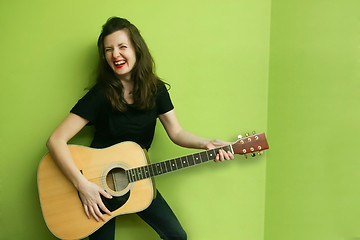 Image showing Young woman with guitar