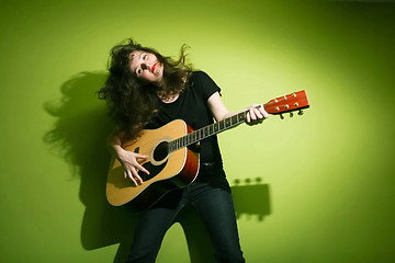 Image showing Woman playing guitar