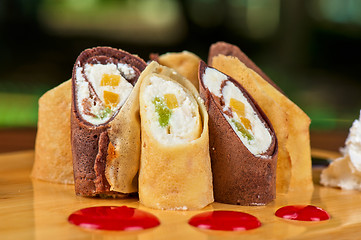 Image showing pancake roll with marmalade