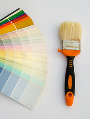Image showing color palette chart and paint brush on white 