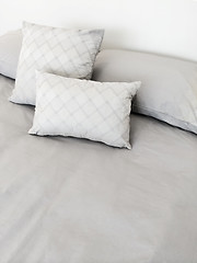 Image showing Grey bed linen and pillows